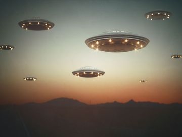 Invasion of alien spaceships at sunset, illustration.