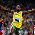 Usain Bolt of Jamaica reacts after breaking the world record with a time of 19.30 to win the gold medal as Churandy Martina (left) of Netherlands Antilles and Brian Dzingai of Zimbabwe come in after him in the Men's 200m Final at the National Stadium during Day 12 of the Beijing 2008 Olympic Games on August 20, 2008 in Beijing, China. (Summer Olympics, track and field, athletics)