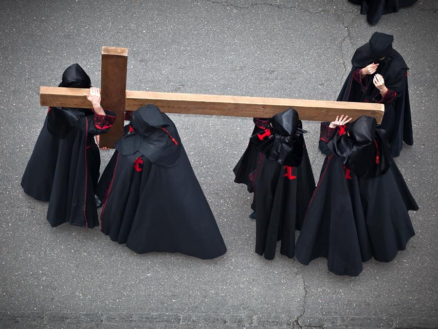 Holy week. Easter. Valladolid. Procession of Nazarenos carry a cross during the Semana Santa (Holy week before Easter) in Valladolid, Spain. Good Friday