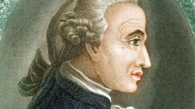 Immanuel Kant (1724-1804), German philosopher. Print published in London, 1812. Profile portrait surrounded by Ouroboros ancient Egyptian-Greek symbolic serpent with tail in mouth devouring itself representing unity of material and spiritual in eternal...